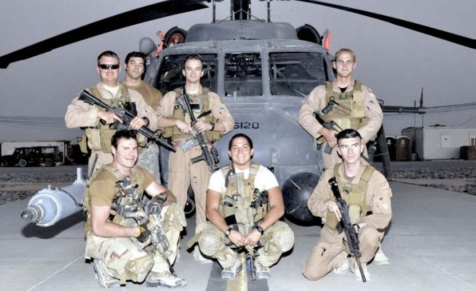 The crew of "Pedro 16" poses in July 2009, at Kandahar Airfield, Afghanistan. Pictured are Capt. Robert Rosebrough (middle, standing), 1st Lt. Lucas Will (right, standing), Master Sgt. Dustin Thomas (far left, standing) and Staff Sgt. Tim Philpott (right, kneeling). The four Airmen from Kadena Air Base’s 33rd Rescue Squadron, were recently announced as the 2009 MacKay Trophy winners. (Courtesy photo)