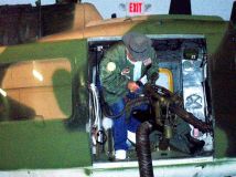 UH-1P 925, Bill Dye Sr. demo’s how gunners fired the mini-guns to musuem staff.4